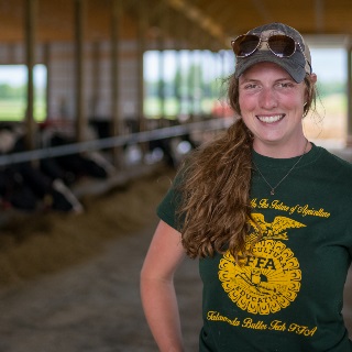 Woman in dairy shed.